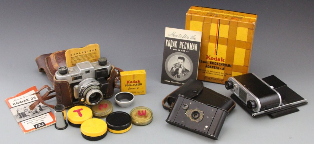 VINTAGE KODAK CAMERAS & ACCESSORIES: VINTAGE KODAK CAMERAS & ACCESSORIES Lot of two Kodak cameras with accessories; Includes an Eastman Kodak Vest Pocket camera with pouch, circa early 20th C., and Kodak 35 Anastigmat with case; Assortme