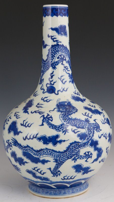 CHINESE QING DYNASTY BLUE & WHITE BULBOUS VASE: CHINESE QING DYNASTY BLUE & WHITE BULBOUS VASE Early 20th century earthenware vase decorated with flying dragons. Size: 15" tall
