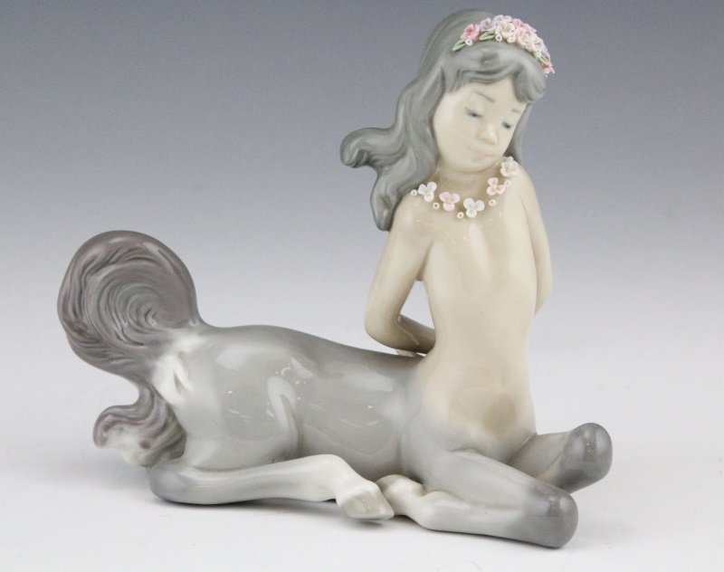 RETIRED LLADRO FIGURINE DEMURE CENTAUR GIRL #5320: RETIRED LLADRO FIGURINE DEMURE CENTAUR GIRL #5320 Lladro porcelain figurine, #01005320, "Demure Centaur Girl", Issue Year: 1985, Retirement Year: 1990, Sculptor: José Puche. Size: 5 x 6" Condition: V