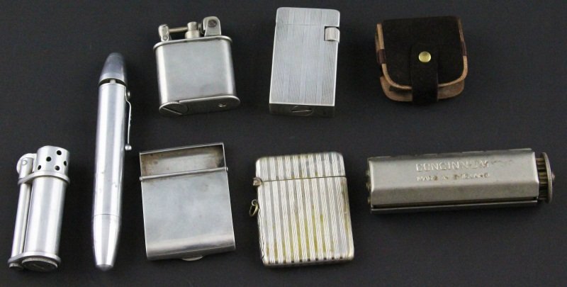(7) MIXED VINTAGE LIGHTERS AND CIGARETTE ROLLER: (7) MIXED VINTAGE LIGHTERS AND CIGARETTE ROLLER Lot of seven; Striped sterling silver lighter, marked on underside; Sterling cigarette paper dispenser, Sterling cased lighter engraved "Hal";Two alumin