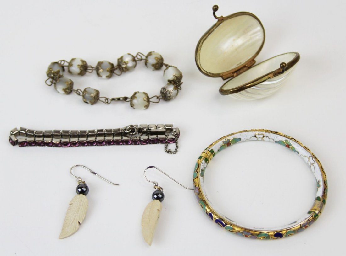 (6) PIECES OF VINTAGE COSTUME JEWELRY: (6) PIECES OF VINTAGE COSTUME JEWELRY Lot of six total; Includes cloisonne bracelet with white ground; purple rhinestone bracelet; feather and pair of hematite drop earrings; mother of pearl change pu