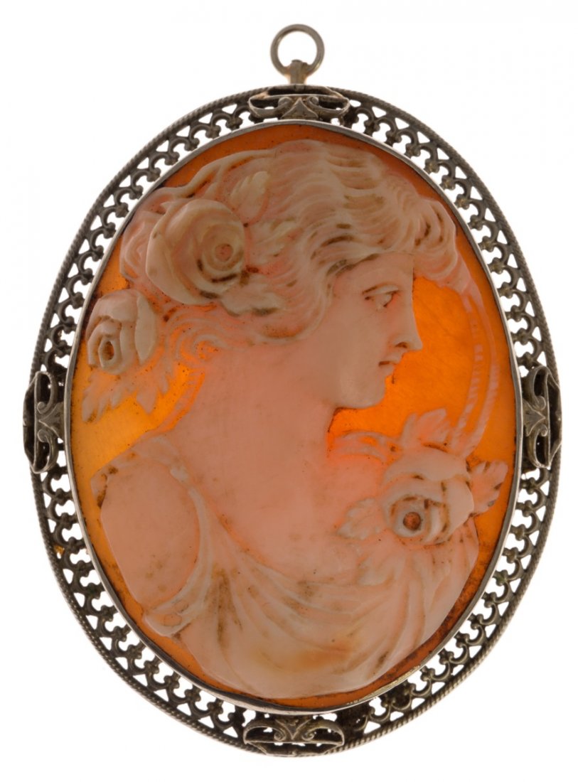 LADIES 10K WHITE GOLD CAMEO BROOCH / PENDANT: LADIES 10K WHITE GOLD CAMEO BROOCH / PENDANT Left facing female carved shell cameo with 10K white gold filigree bezel. Can be worn as brooch or pendant. Weight: 9.9g Size: 1.75 x 1.5" Condition: Very 