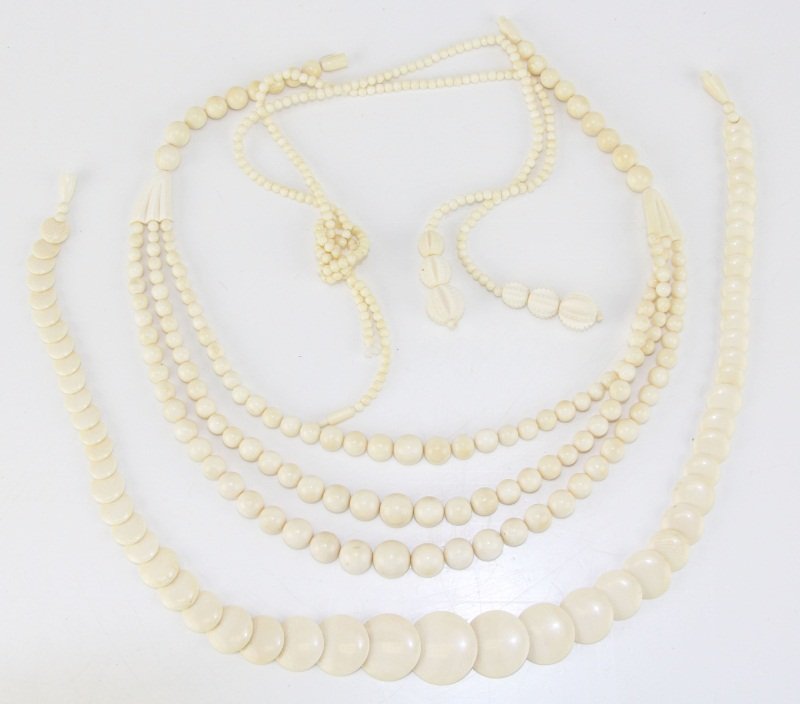 (3) IVORY BEADED NECKLACES: (3) IVORY BEADED NECKLACES Three ivory beaded necklaces. A three-strand necklace with ivory beads ranging from 4-11.8mm. A beaded necklace with 3.5mm beads and 3 graduated carved balls at the end of e