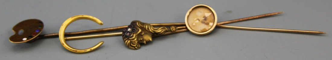 (4) LADIES VINTAGE 14K YELLOW GOLD HAT PINS: (4) LADIES VINTAGE 14K YELLOW GOLD HAT PINS Four vintage ladies hat pins: artist's palate, horseshoe, art nouveau style female profile, and morning or keepsake style pin. Weight: 9.1g Size: 2 -3" Cond