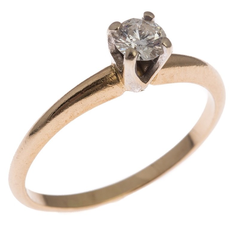 LADIES 14K GOLD DIAMOND SOLITAIRE ENGAGMENT RING: LADIES 14K GOLD DIAMOND SOLITAIRE ENGAGMENT RING Diamond solitaire engagement ring. 14K yellow gold band with 4 white gold prongs. Round brilliant cut diamond of approximately 0.33 ct, SI clarity and 