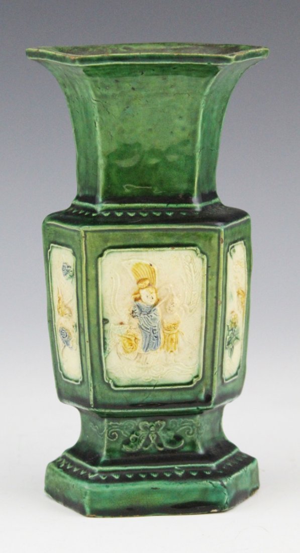 19TH C JAPANESE EARTHENWARE VASE: 19TH C JAPANESE EARTHENWARE VASE Antique Japanese earthenware vase, circa 19th C.; Leaf green, depicting six vignettes in relief of genre and floral scenes, unmarked. Size: 7.25"