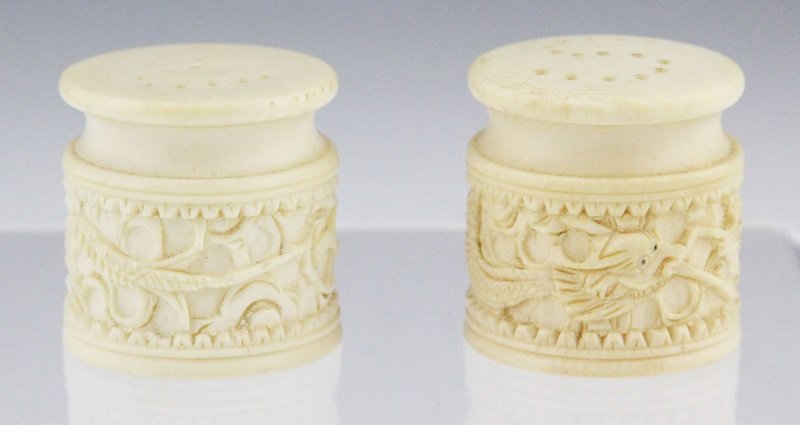 PAIR OF CHINESE IVORY SALT & PEPPER SHAKERS-DRAGON: PAIR OF CHINESE IVORY SALT & PEPPER SHAKERS-DRAGON Pair of Chinese carved ivory salt and pepper shakers; Dragon motif with pieced "S" and "P" lids. Marked on underside. Weight: 42.4g total Size: 1.5 x