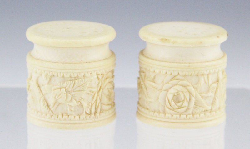 PAIR OF CHINESE IVORY SALT & PEPPER SHAKERS-ROSES: PAIR OF CHINESE IVORY SALT & PEPPER SHAKERS-ROSES Pair of Chinese carved ivory salt and pepper shakers; Rose motif with pieced "S" and "P" lids. Marked on underside. Weight: 44g total Size: 1.5 x 1.5"