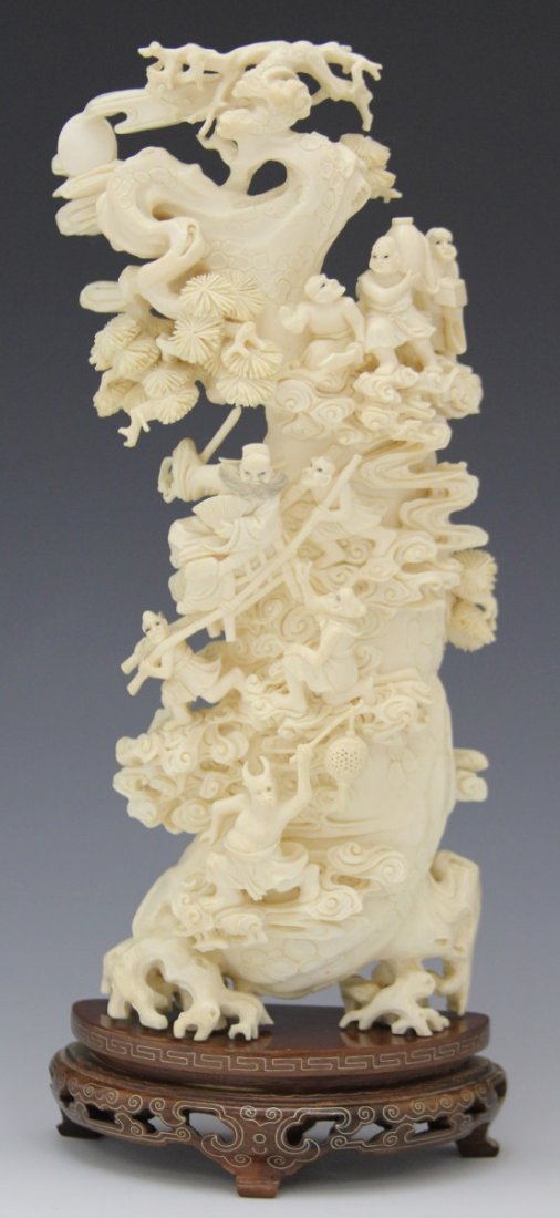 CHINESE IVORY CARVING OF ZHONG KUI GHOST HUNTER: CHINESE IVORY CARVING OF ZHONG KUI GHOST HUNTER Large, carved ivory scene featuring Zhong Kui, vanquisher of ghosts and evil beings, traveling with his band of demons and guardians. Zhong Kui is being
