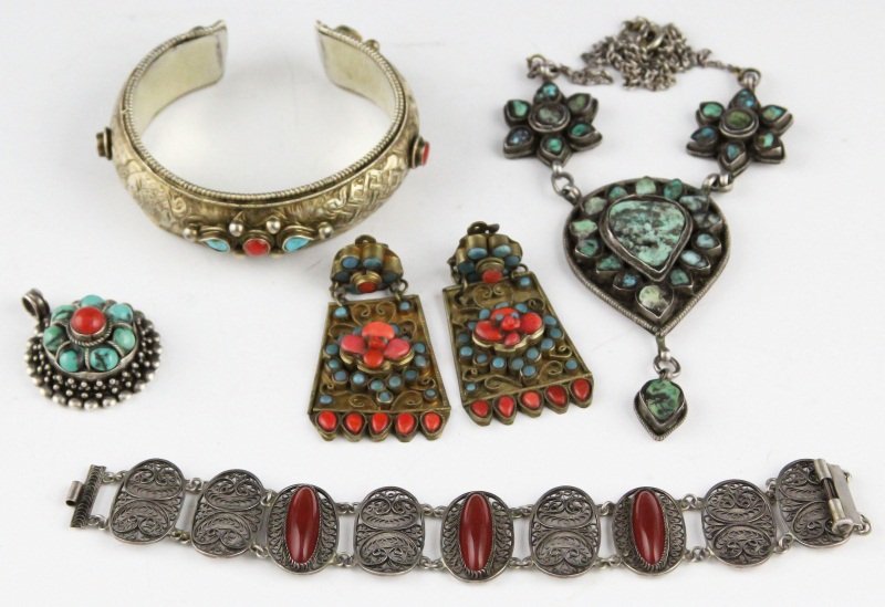 ASIAN SILVER JEWELRY TURQUOISE CORAL CARNELIAN: ASIAN SILVER JEWELRY TURQUOISE CORAL CARNELIAN Four pieces of silver jewelry: silver repousse cuff bracelet with turquoise and coral accents; sterling circular pendant with coral center surrounded by 