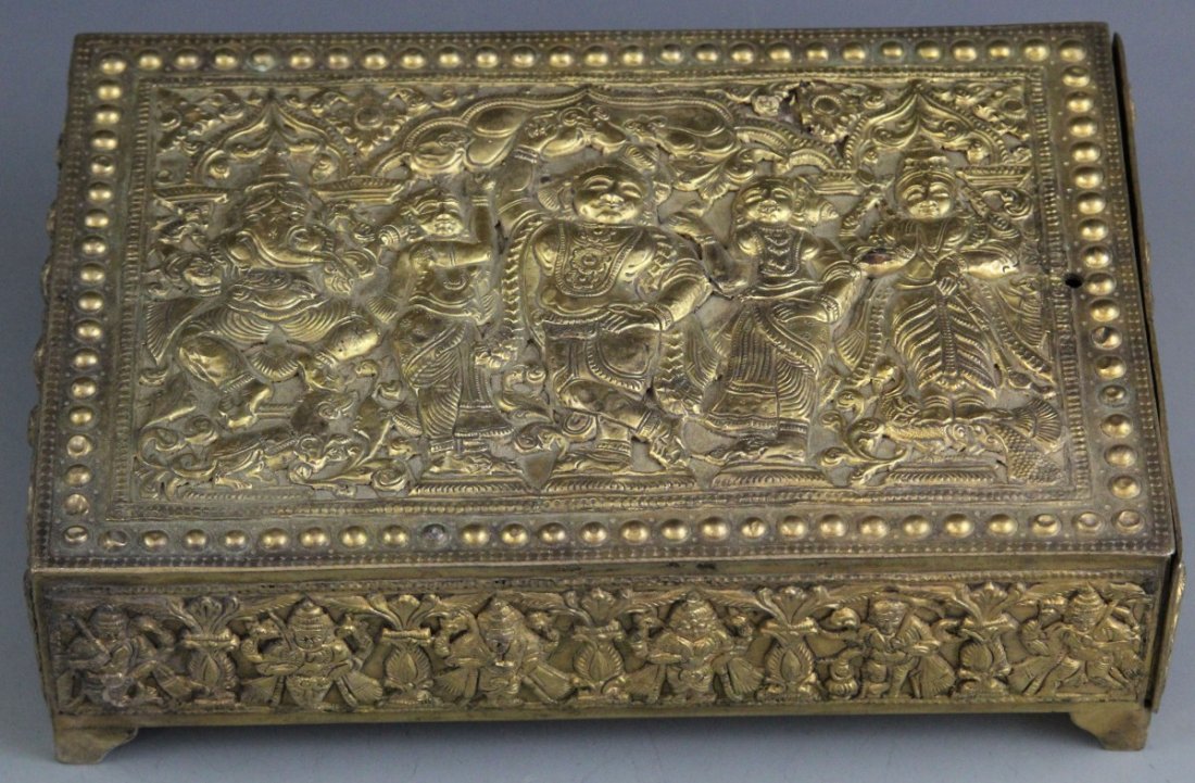 HINDU RELIEF BRASS BOX WITH DRAWER: HINDU RELIEF BRASS BOX WITH DRAWER Brass box with drawer, decorated with relief featuring Hindu gods and goddesses. Some loss to relief. Drawer lined with red silk. No markings. Weight: 1125g Size: 7.