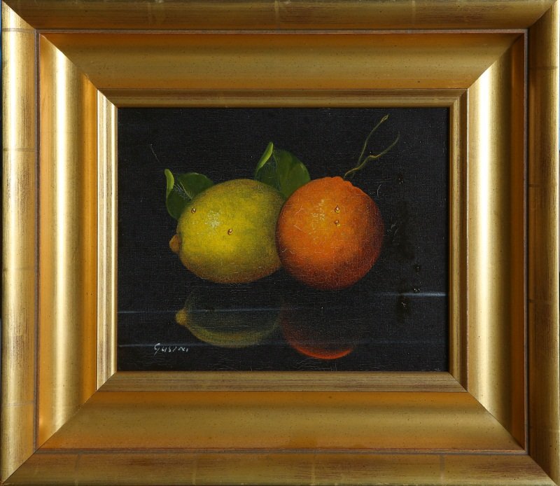 ANTONIO GUSINI ORANGE & LEMON OIL ON CANVAS: ANTONIO GUSINI ORANGE & LEMON OIL ON CANVAS Oil on canvas, still life with orange and lemon by Antonio Gusini (Italian, 20th C.). Signed in lower left, set in gilt wood frame. Size: 15.5 x 13.5" frame