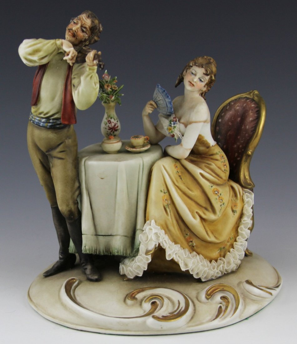 ANTONIO BORSATO PLAY GYPSY PLAY PORCELAIN FIGURE: ANTONIO BORSATO PLAY GYPSY PLAY PORCELAIN FIGURE Porcelain figure by Antonio Borsato, made in Italy. Play Gypsy Play, #771. Seated woman with fan listening to violin player. Figure is signed and stamp