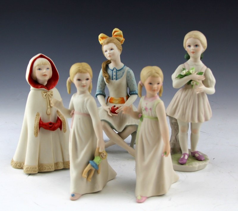 (5) CYBIS PORCELAIN GIRL FIGURES: (5) CYBIS PORCELAIN GIRL FIGURES Five porcelain figures by Cybis: Little Red Riding Hood (7"); Heidi, girl holding flowers (7.75"); Pollyanna, girl with apple (8"); one girl with pigtails holding a fl