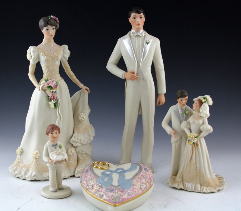 (5) CYBIS PORCELAIN WEDDING THEMED FIGURES: (5) CYBIS PORCELAIN WEDDING THEMED FIGURES Five porcelain figures by Cybis: 12" bride figure with delicate floral details; 12" groom figure with simple tuxedo attire; 7" bride and groom; 4.75" ring be
