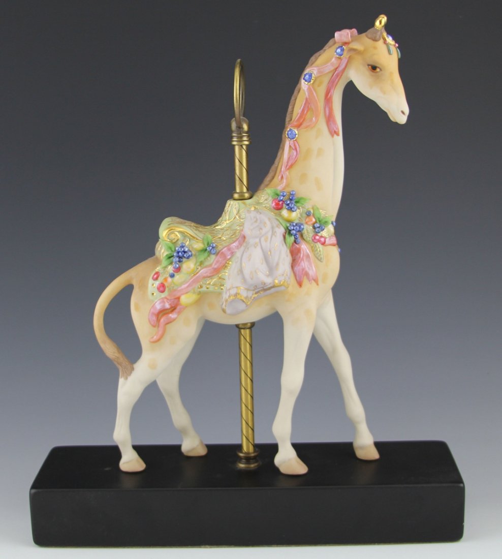 CYBIS PORCELAIN CAROUSEL GIRAFFE SIR CUTHBERT: CYBIS PORCELAIN CAROUSEL GIRAFFE SIR CUTHBERT Cybis porcelain carousel giraffe, "Sir Cuthbert", with wooden stand. Bottom is marked #134 and signed. Size: 12.5"