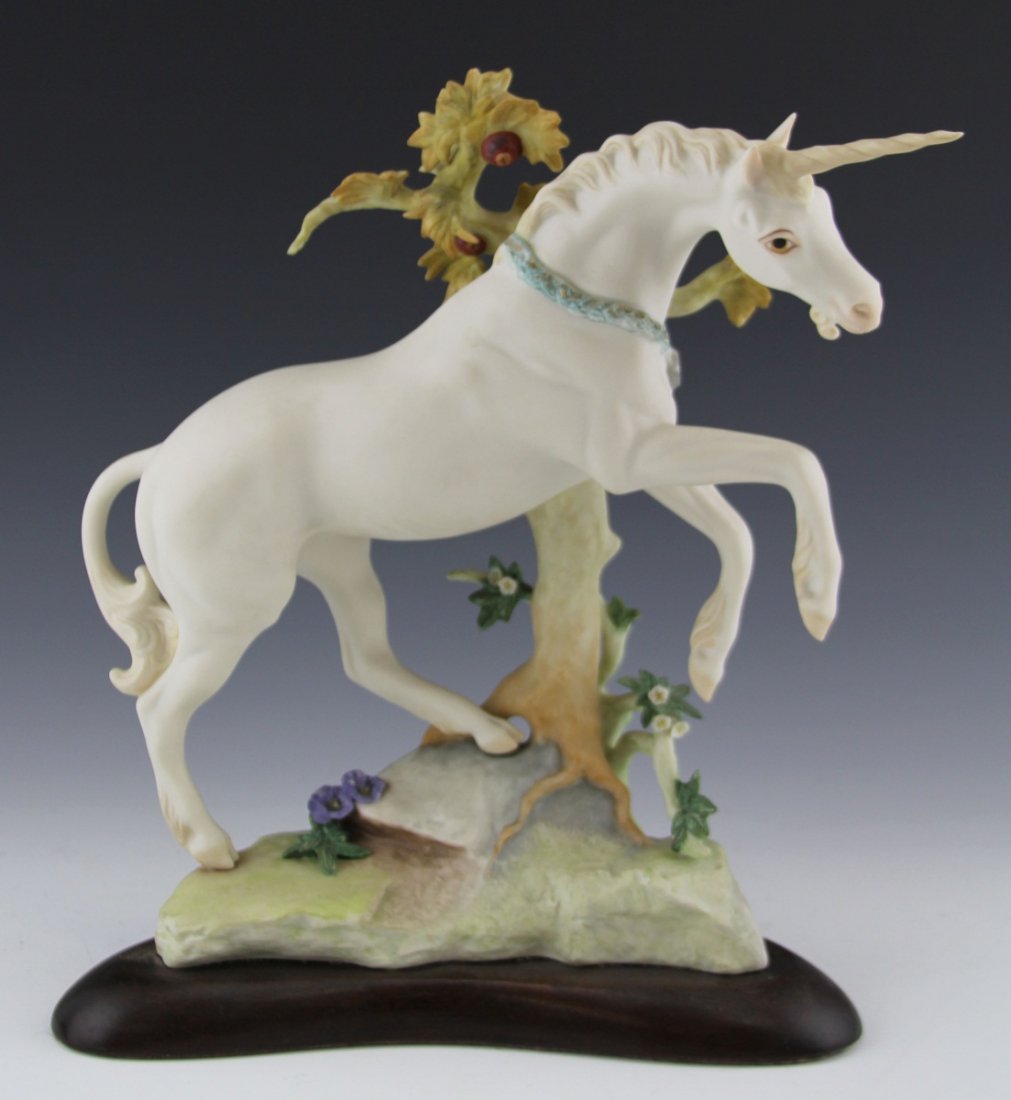CYBIS PORCELAIN FIGURE OF A UNICORN: CYBIS PORCELAIN FIGURE OF A UNICORN Cybis porcelain figure of a unicorn, on a wooden base. #465. Size: 12.5 x 11"