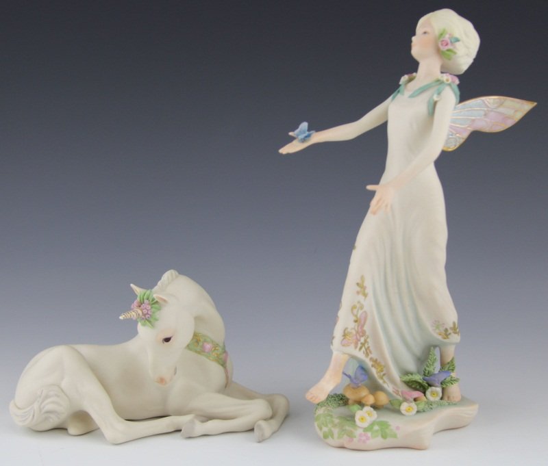 (2) CYBIS PORCELAIN FIGURINES: (2) CYBIS PORCELAIN FIGURINES Two porcelain figures by Cybis. Includes: Queen Titania, #487 and Sir Bailey the unicorn. Both marked Cybis. Size: ~7 - 10"