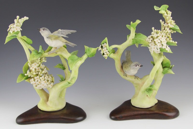 (2) CYBIS PORCELAIN FLOWER & BIRD FIGURINES: (2) CYBIS PORCELAIN FLOWER & BIRD FIGURINES Two Cybis bisque porcelain figurines. Fluttering birds amongst white wildflowers, signed and # 299, includes fitted wood base. Size: 11 x 7"