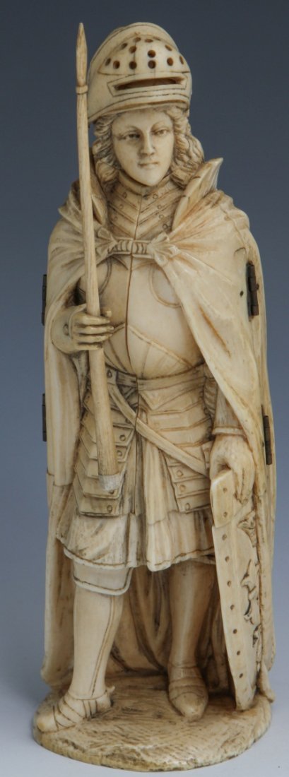 EUROPEAN CARVED IVORY JOAN OF ARC TRIPTYCH: EUROPEAN CARVED IVORY JOAN OF ARC TRIPTYCH Highly detailed European ivory carved triptych of Joan of Arc. When closed, Joan of Arc stands in full armour with shield in one hand and spear in the other.