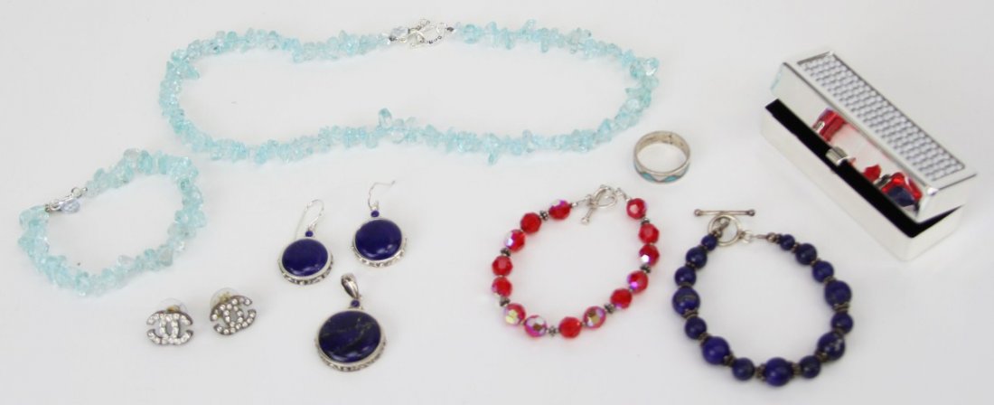 LADIES STERLING JEWELRY & SWAROVSKI LIPSTICK CASE: LADIES STERLING JEWELRY & SWAROVSKI LIPSTICK CASE Silver toned Swarovski velvet lined lipstick case with box. Sterling band with inlaid mop and turquoise. Red beaded bracelet with sterling heart clasp
