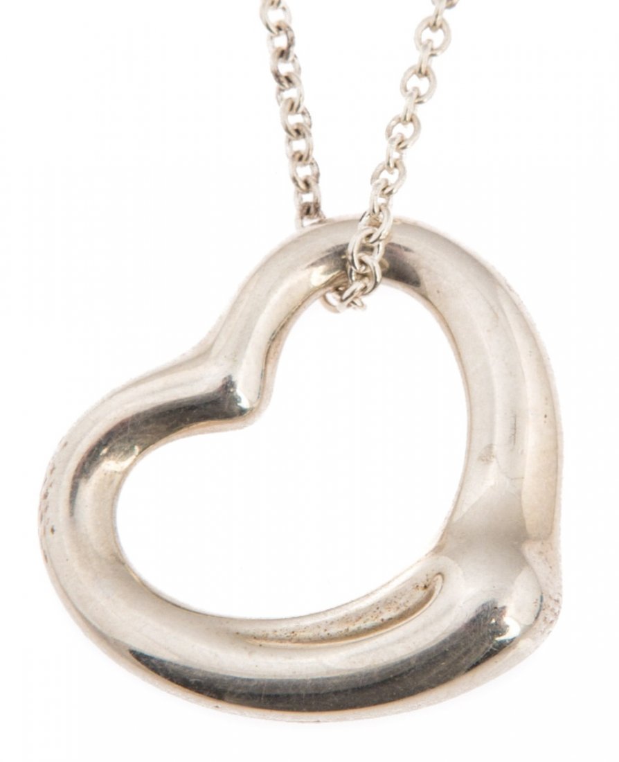 TIFFANY & CO STERLING ELSA PERETTI HEART NECKLACE: TIFFANY & CO STERLING ELSA PERETTI HEART NECKLACE Ladies sterling necklace with heart pendant by Elsa Peretti for Tiffany and Company. Pendant is marked "Tiffany & Co (c) Elsa Peretti 925 Spain", chai