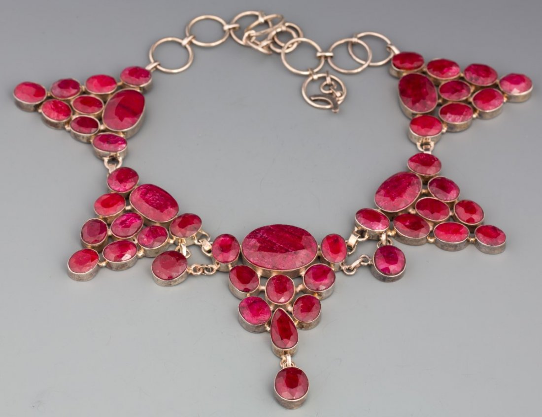 NATURAL RUBY CORUNDUM STERLING NECKLACE 284.34 CTW: NATURAL RUBY CORUNDUM STERLING NECKLACE 284.34 CTW Ladies sterling necklace with natural ruby corundum stones, approximately 284.34 CTW. Comes with GLA appraisal. One stone is out of setting, but incl
