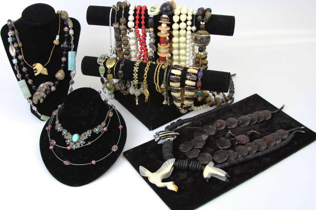 MIXED LOT COSTUME JEWELRY NECKLACES & BRACELETS: MIXED LOT COSTUME JEWELRY NECKLACES & BRACELETS Large mixed lot of costume jewelry necklaces and bracelets; Includes stone, bone, and natural material necklaces with large statement animal beads, gold