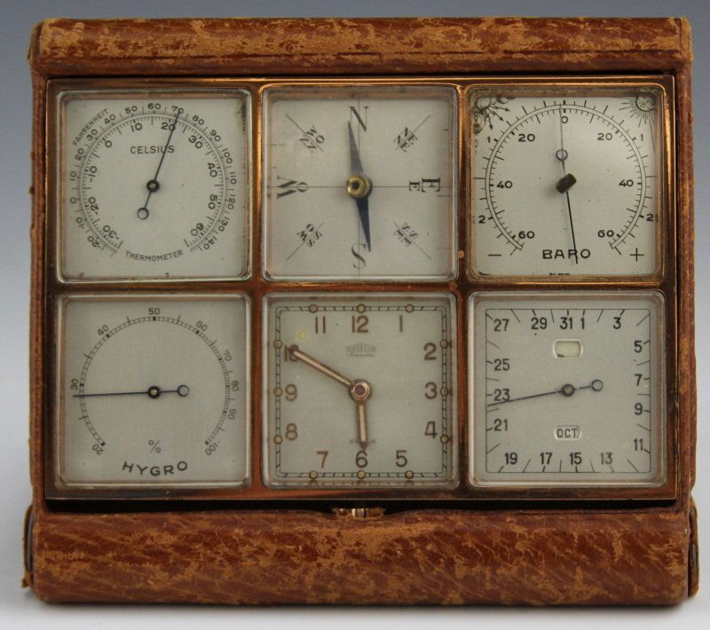 ANGELUS 8 DAY LEATHER & GILT BRASS DESK COMPENDIUM: ANGELUS 8 DAY LEATHER & GILT BRASS DESK COMPENDIUM Angelus 8 Day desk compendium, six instruments in gilt brass and leather case. Includes barometer and thermometer, hygrometer, compass, calendar, and