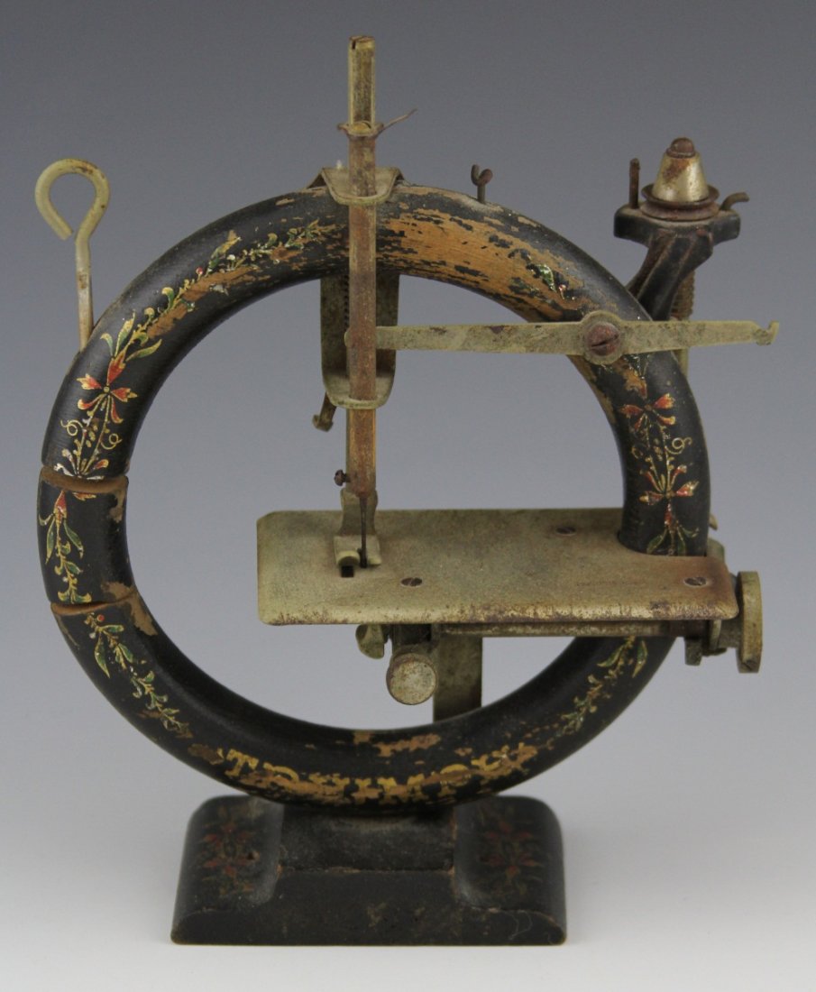 WOODEN CIRCULAR TRIUMPH TOY SEWING MACHINE