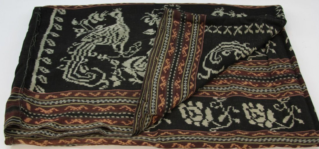 20TH CENTURY INDONESIAN SARONG: 20TH CENTURY INDONESIAN SARONG Indonesian sarong, circa 20th C., Timor Island. Decorated with geometric patterns; black, white, coral, and burgundy in color. Sewn together. Size: 44 x 59"