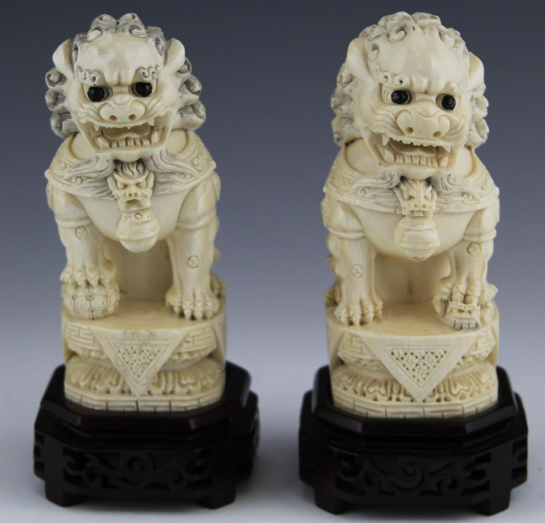 PAIR OF CHINESE CARVED IVORY FOO DOGS