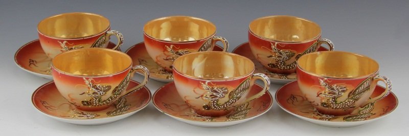 (6) JAPANESE TEACUPS & SAUCER JB BETESON PORCELAIN: (6) JAPANESE TEACUPS & SAUCER JB BETESON PORCELAIN Set of six teacups and saucers J.B. Beteson Moriage Porcelain. Hand painted with dragon motif, bead and low relief motif. Marked on base "Made in Occ
