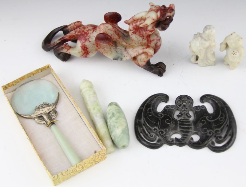 (6) CHINESE CARVED JADE PIECES: (6) CHINESE CARVED JADE PIECES Six Chinese carved jade pieces. A mottled red and celadon jade dragon, a black jade bat with coin, a green jade magnify glass, a green jade bead, a green jade wand and t