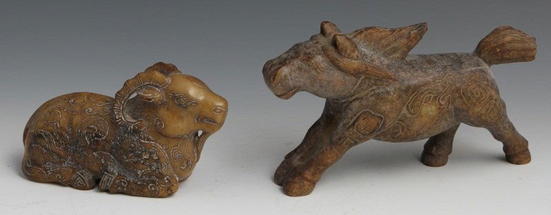(2) CHINESE CARVED JADE STATUES OF HORSE & RAM: (2) CHINESE CARVED JADE STATUES OF HORSE & RAM Two Chinese carved jade figural statues. Includes one recumbent ram, 4 x 6.5", with incised details and deep yellow in color; one galloping horse with in