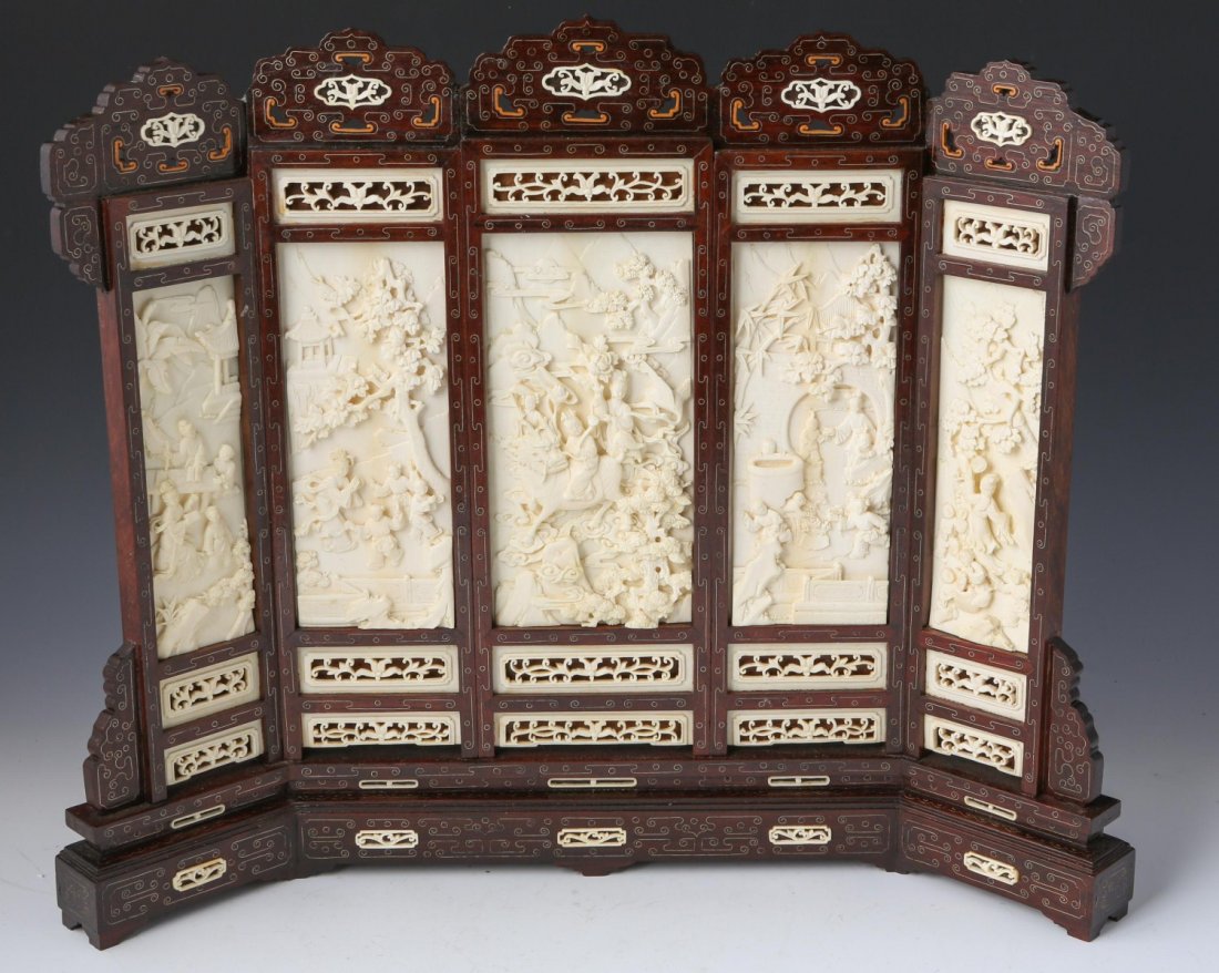 CHINESE CARVED IVORY & ROSEWOOD TABLE SCREEN: CHINESE CARVED IVORY & ROSEWOOD TABLE SCREEN Intricately carved ivory and rosewood table screen, late 19th C. Five central panels, each telling a piece of a narrative. Decorative ivory pieces adorn th