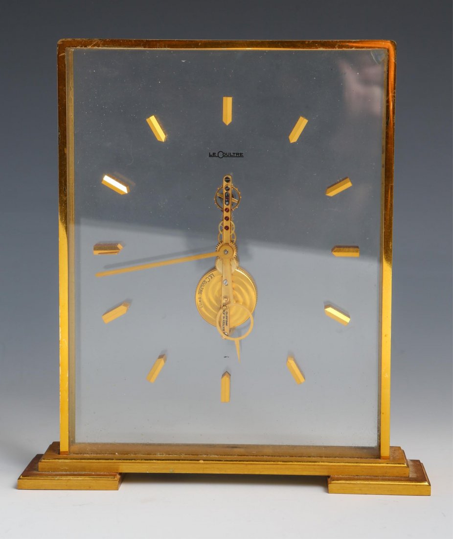 LE COULTRE 8 DAY MANTEL CLOCK: LE COULTRE 8 DAY MANTEL CLOCK Le Coultre 8 day mantel clock. Glass panels in front of and behind the movement. Size: 6 x 7.75"