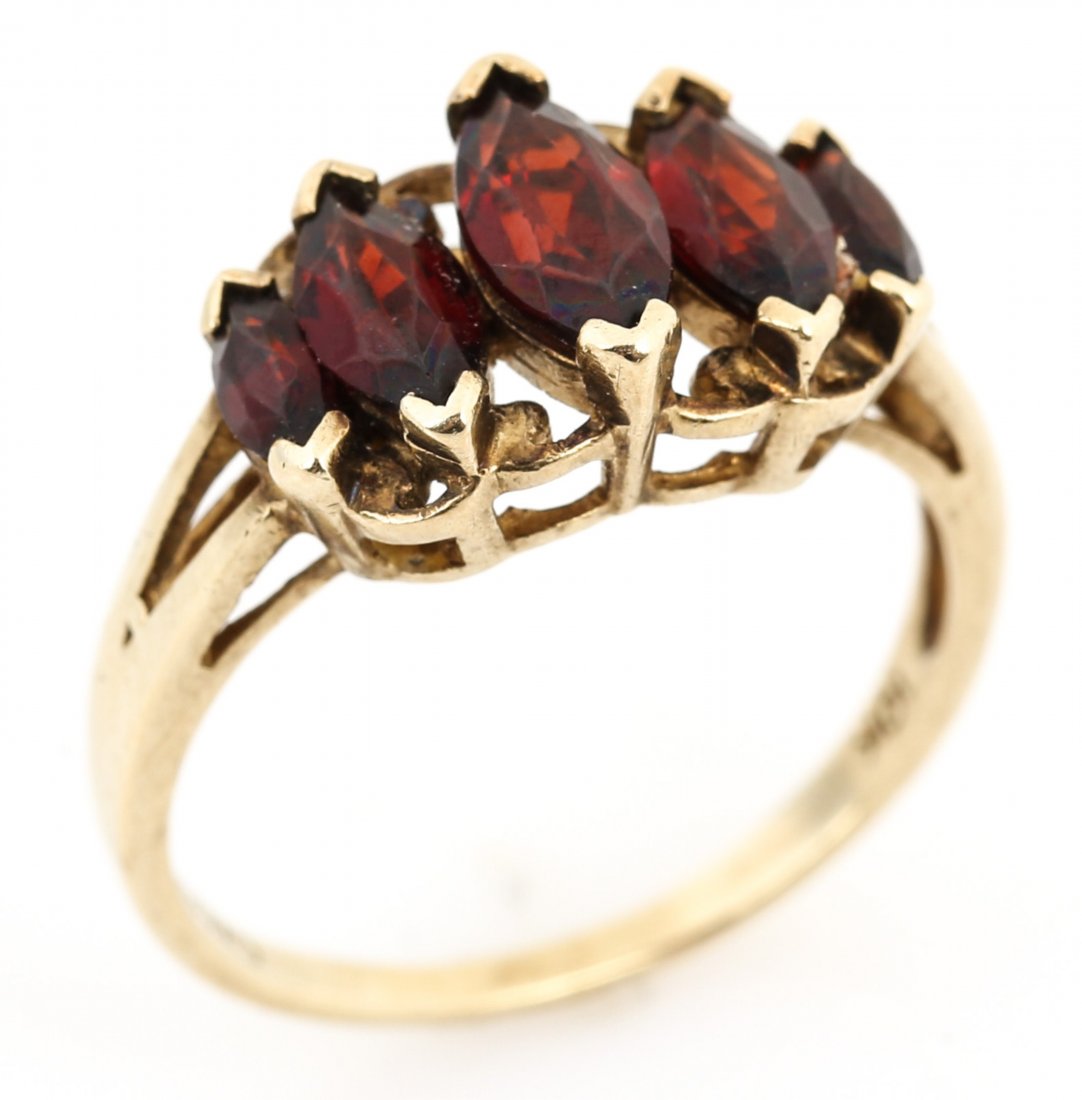 LADIES 10K YELLOW GOLD GARNET FASHION RING: LADIES 10K YELLOW GOLD GARNET FASHION RING Ladies 10K yellow gold garnet fashion ring. Five marquise cut garnets, ranging from the largest, approximately .47 ct, to smallest, approximately .14 ct (~1.
