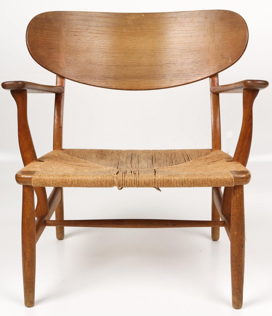 MID-CENTURY MODERN OAK LOUNGE CHAIR HANS WEGNER: MID-CENTURY MODERN OAK LOUNGE CHAIR HANS WEGNER Mid-century modern chair by Hans Wegner, Denmark, 1951, made by Carl Hansen & Son, oak and rush. Size: 27 x 24 x 28.5"