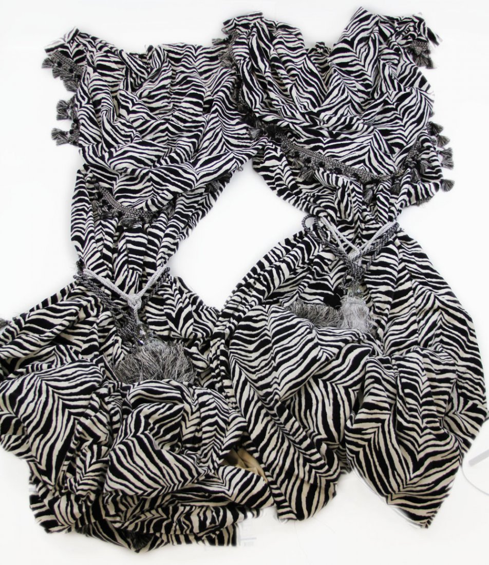 TWO PIECE BEADED ZEBRA PRINT CURTAIN SET: TWO PIECE BEADED ZEBRA PRINT CURTAIN SET Large heavy material zebra print two piece curtain set, decorated with twisted tasseled ends; Includes two pairs of heavy black and silver tassels. Fixed with 