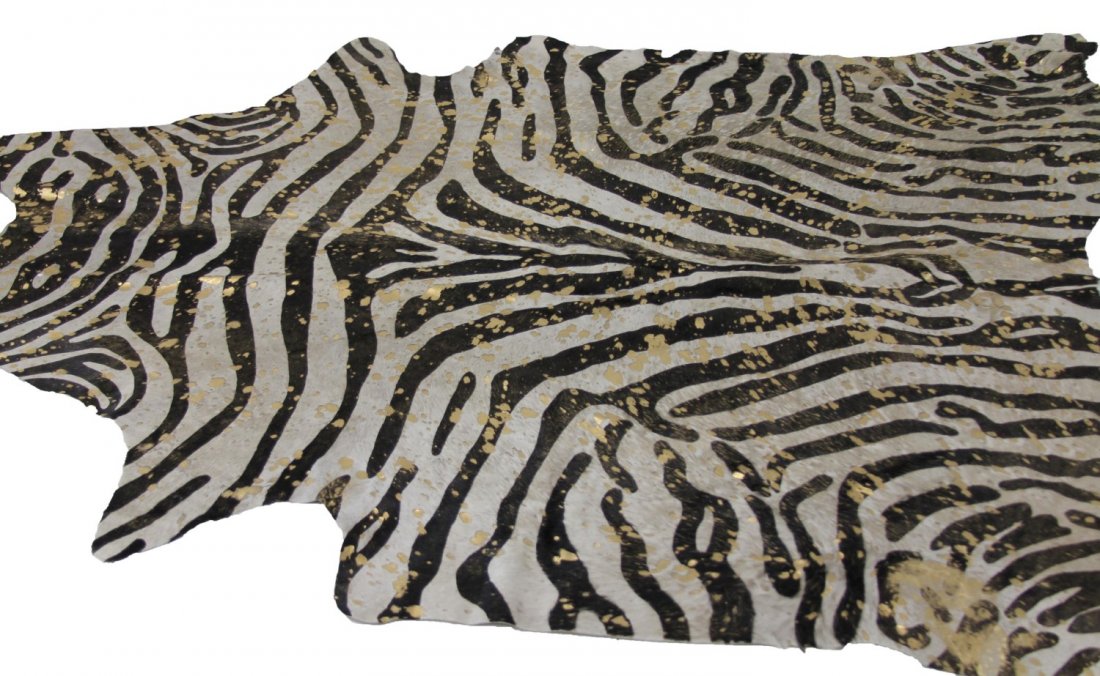 GOLD SPECKLED ZEBRA PATTERN COW HIDE RUG: GOLD SPECKLED ZEBRA PATTERN COW HIDE RUG Gold speckled painted zebra pattern cow hide rug, made in Brazil. Size: ~80 x 90"
