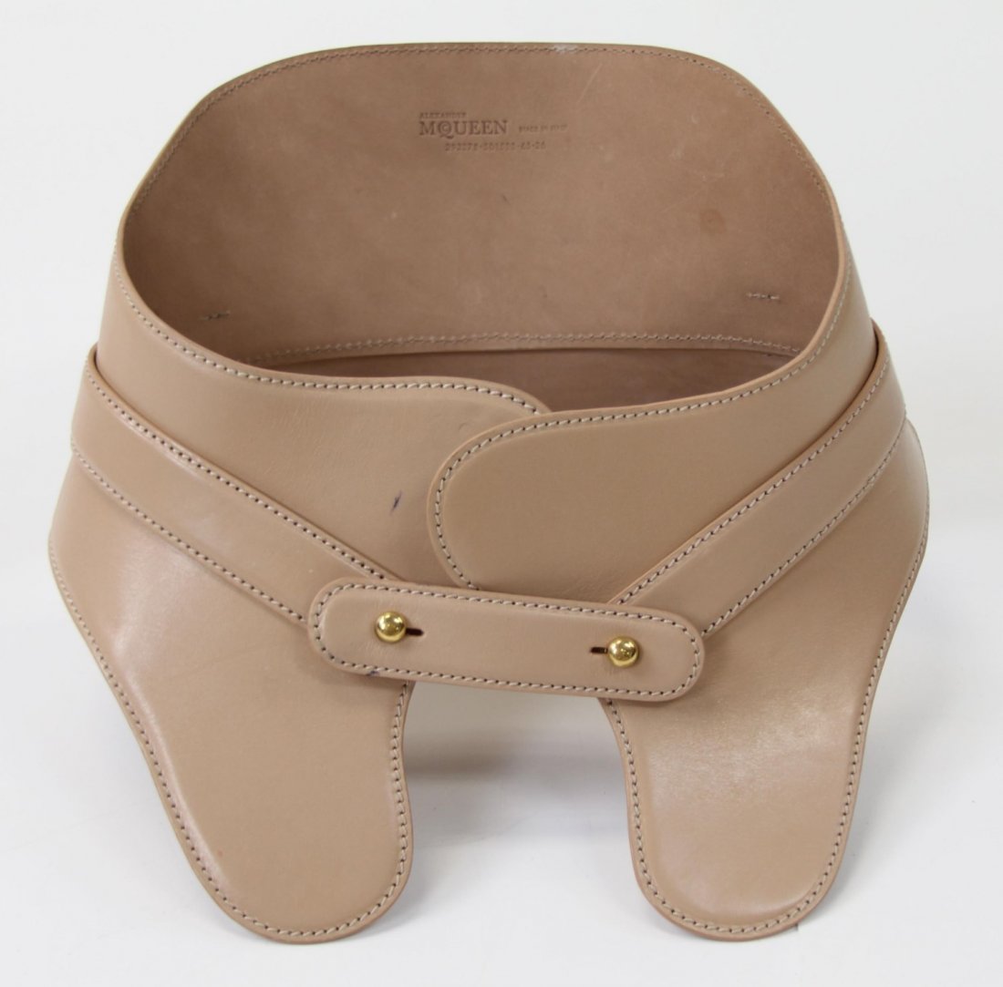 ALEXANDER MCQUEEN CORSET BRIDLE BELT: ALEXANDER MCQUEEN CORSET BRIDLE BELT Alexander McQueen tan color leather corset bridle belt with front fastener. Stamped "Alexander McQueen Made in Italy" on the interior. Size: 8.5 x 10 x 6"