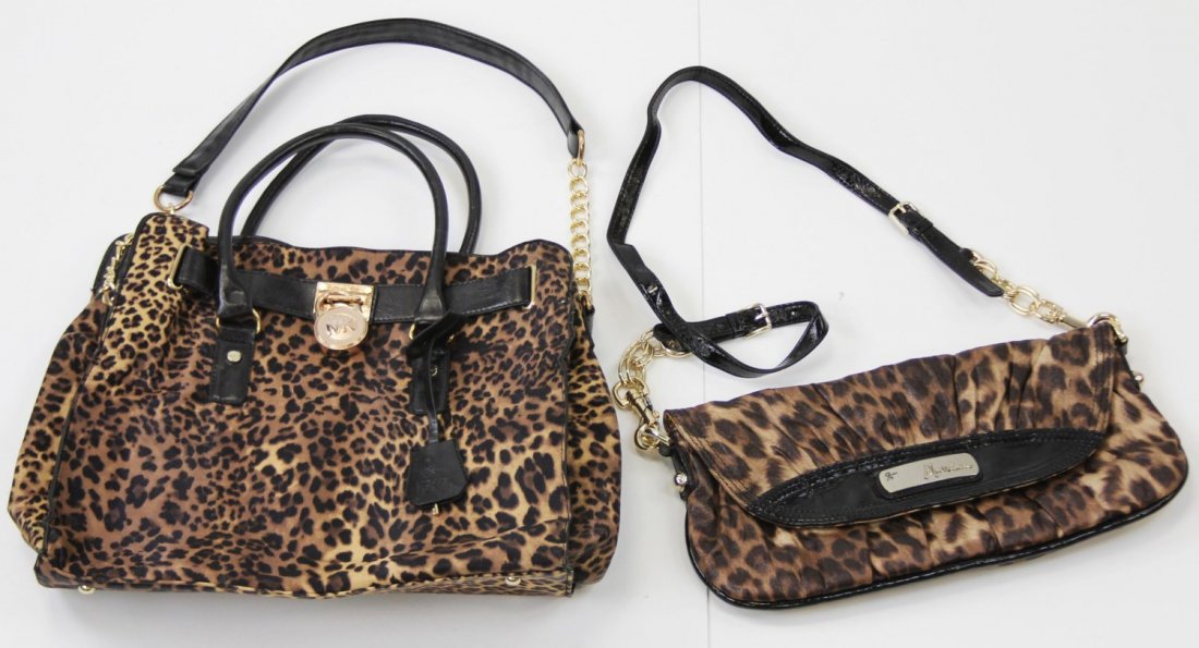 (2) LEOPARD PRINT DESIGNER HANDBAGS: (2) LEOPARD PRINT DESIGNER HANDBAGS Two leopard print designer handbags. One Guess by Marciano (14.5 x 7") and one Michael Kors (13 x 14").