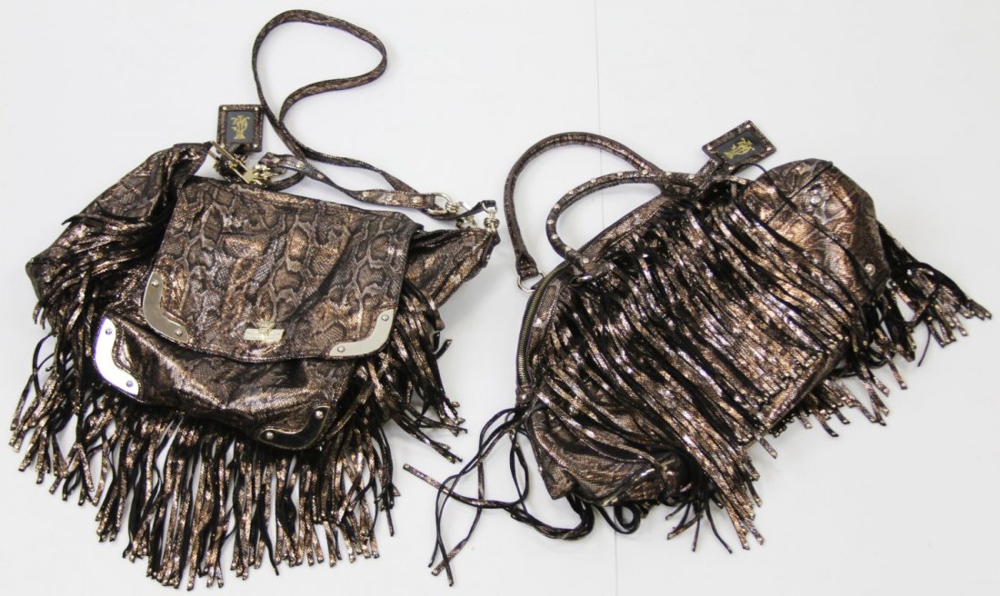 (2) JUICY COUTURE METALLIC PATTERN HANDBAGS: (2) JUICY COUTURE METALLIC PATTERN HANDBAGS Two Juicy Couture metallic pattern handbags, both with same metallic reptilian pattern over a soft fabric.