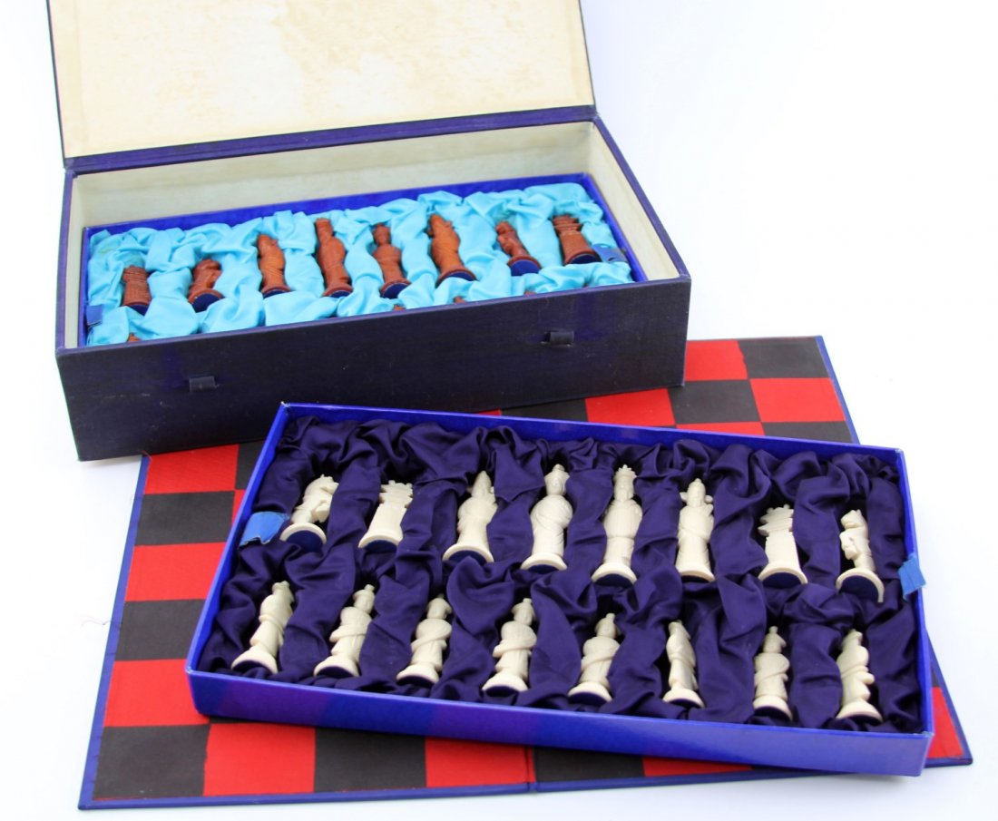 CHINESE BONE CHESS SET: CHINESE BONE CHESS SET Chinese carved bone chess set with board and storage box, one set of pieces are stained. Size: ~ 2.5 - 3.5" pieces