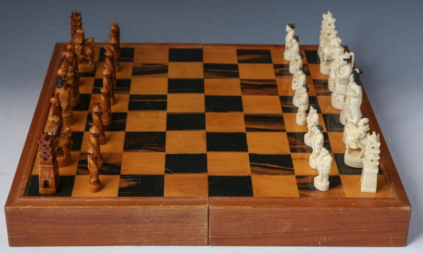 Chess pieces: 32 red and white ivory pieces without board., Complete number  of pieces of a chess game. Sixteen cut ivory pieces that have been made red  with a dyestuff: these are