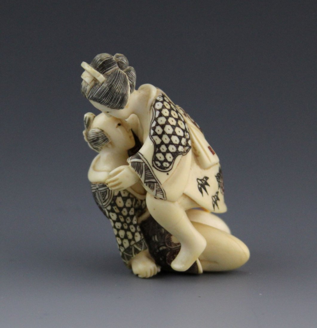 ANTIQUE IVORY EROTIC POLYCHROME NETSUKE: ANTIQUE IVORY EROTIC POLYCHROME NETSUKE Antique ivory, erotic polychrome netsuke. Involves two figures that separate and can be attached at their genitals. Details on the clothing of both figures is p