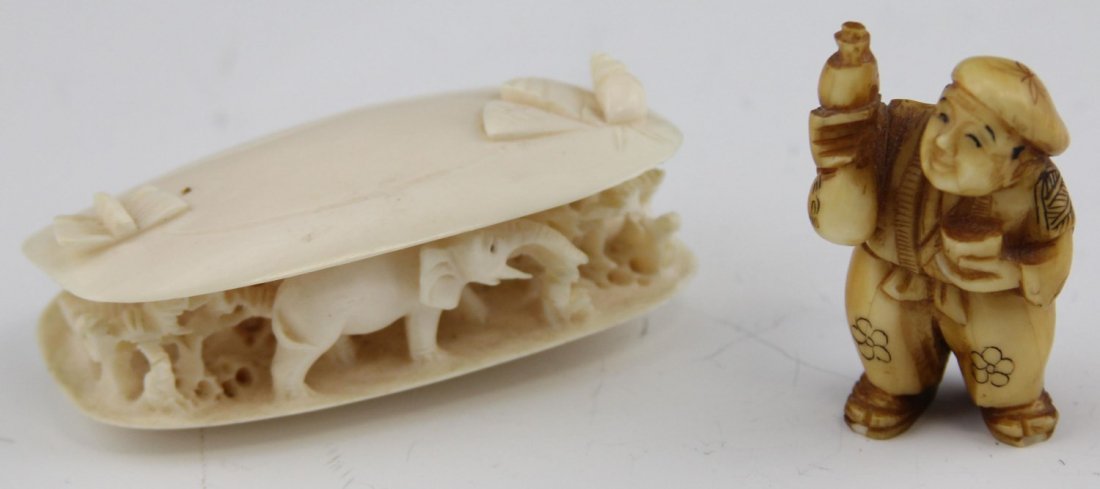 DRINKING MAN NETSUKE AND CLAMS DREAM OKIMONO: DRINKING MAN NETSUKE AND CLAMS DREAM OKIMONO Mid 20th C. Drinking man netsuke with signature on bottom right foot (2", 26.1g). Clam's dream okimono with elephant and tree imagery (3", 43.9g).