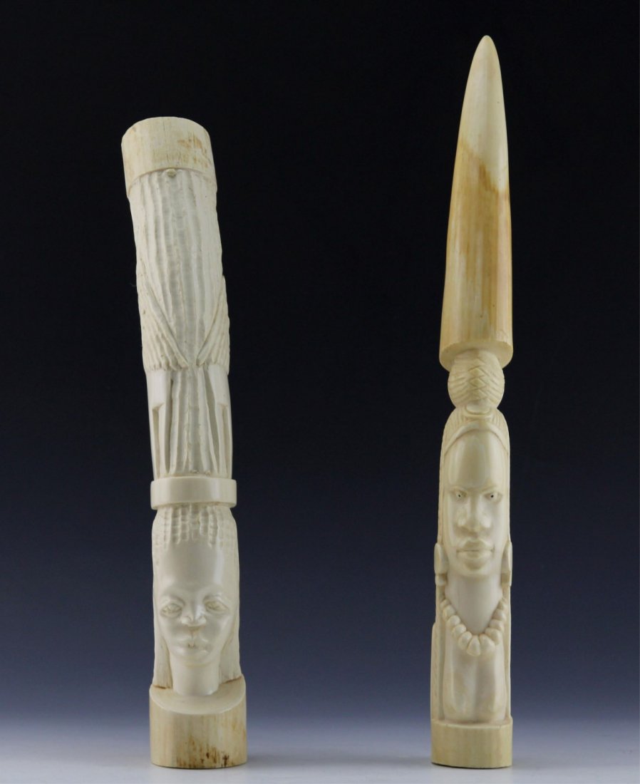 (2) AFRICAN IVORY TRIBAL CARVING ELEPHANT TUSK: (2) AFRICAN IVORY TRIBAL CARVING ELEPHANT TUSK Lot of two antique African carved ivory elephant tusks; Includes solid tapered and hollowed tusk. Both depict figural carvings of females. Weight: 3.8 lb