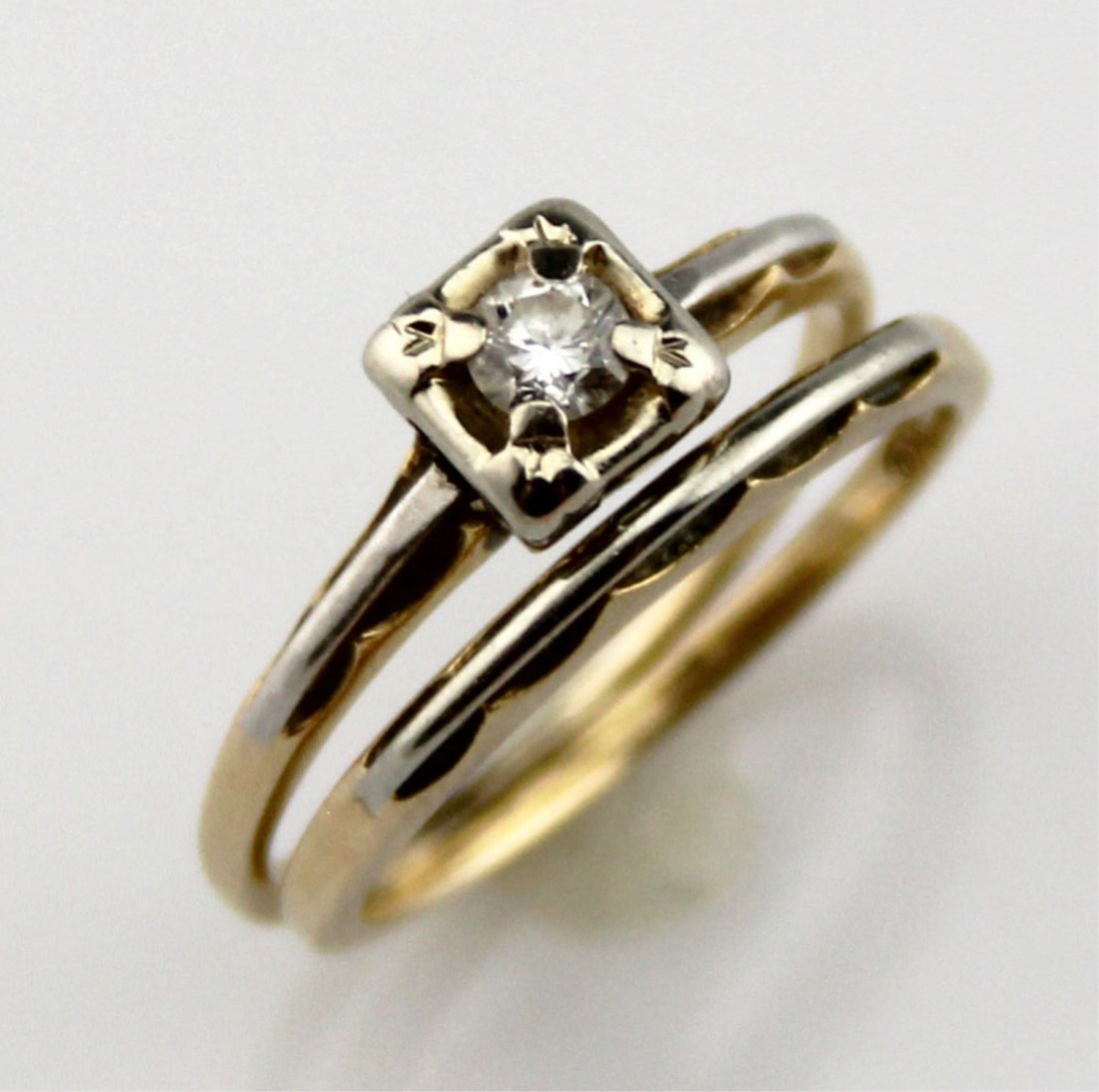 LADIES 14K & 18K YELLOW GOLD DIAMOND RING SET: LADIES 14K & 18K YELLOW GOLD DIAMOND RING SET Ladies 14K and 18K yellow gold solitaire diamond engagement ring set with scalloped white gold elements. Center diamond is approximately .22 ctw. Weight: 
